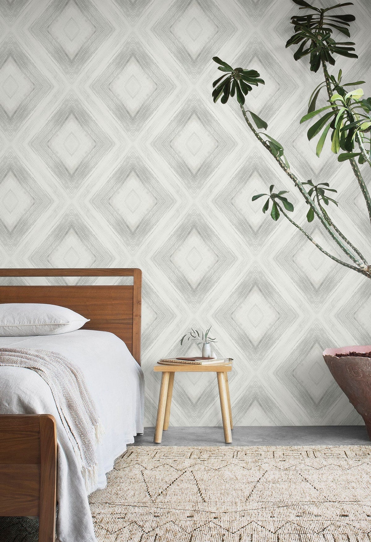 Ballad wallpaper in black features a large diamond pattern in a modern bedroom setting.