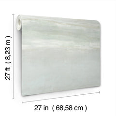 A roll of Serene Reflection Wallpaper in a pale green and white ombre design, measuring 27 feet long and 27 inches wide.