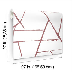 A roll of York Wallcoverings Intersect Wallpaper featuring a geometric pattern of intersecting dusty pink lines on a white background.