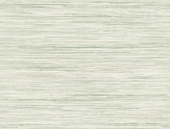 Bahiagrass Wallpaper by York Wallcoverings features a light beige textured surface adorned with subtle horizontal greenish lines that evoke the look of woven fabric or grasscloth. The soft, organic pattern creates a calm and natural ambiance.