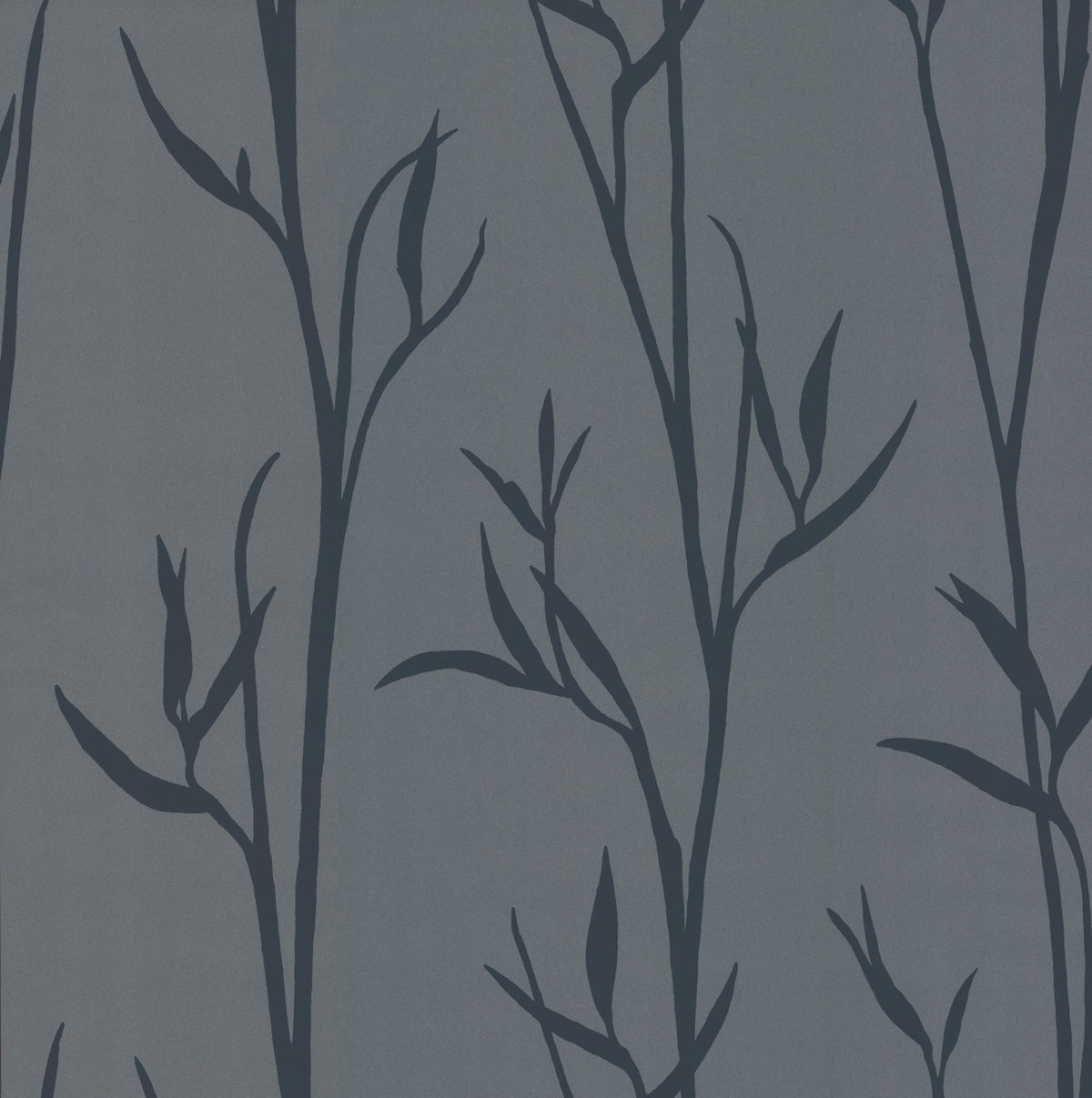 The Matcha Wallpaper by York Wallcoverings features dark blue silhouettes of leafy branches on a muted gray background, creating a simple botanical pattern with a natural, elegant feel.