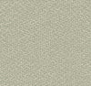 The Galaxies Wallpaper by York Wallcoverings features an abstract, organic design with irregular white dots dispersed across a muted green background, evoking the textured appearance of pebbles or confetti.