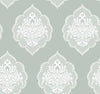 Experience timeless elegance with the Signet Medallion Damask Wallpaper by York Wallcoverings, featuring ornate white floral damask motifs set against a muted sage green background. This wallpaper’s evenly repeating design creates a sophisticated and vintage-inspired ambiance in any room.