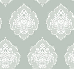 Experience timeless elegance with the Signet Medallion Damask Wallpaper by York Wallcoverings, featuring ornate white floral damask motifs set against a muted sage green background. This wallpaper’s evenly repeating design creates a sophisticated and vintage-inspired ambiance in any room.
