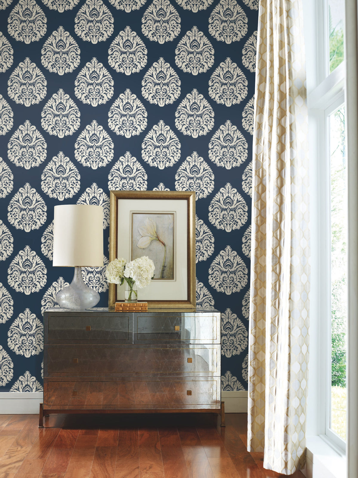 Ronald Redding Teardrop Damask Wallpaper in dark blue featuring a repeating white teardrop-shaped damask pattern.