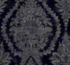 Ronald Redding Charleston Damask Wallpaper featuring a dark navy blue background with a faded, beige, ornate damask floral pattern.