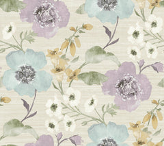 Evelyn Floral Wallpaper by York Wallcoverings showcases a vibrant floral pattern with large blue, purple, and white flowers accompanied by green and yellow stems and leaves, all set against a light beige textured background.