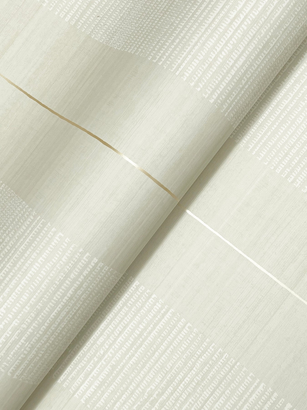 A close-up of Colbert Stripe Textured Wallpaper in light beige, featuring subtle vertical textured lines and two thin metallic horizontal stripes crossing diagonally.
