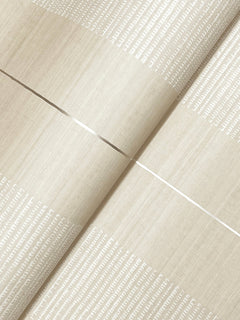 A close-up of two sheets of Colbert Stripe Textured Wallpaper in beige, featuring horizontal and vertical shimmering lines intersected by white dotted patterns across the surface.