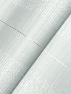 Close-up of Colbert Stripe Textured Wallpaper in pale gray, featuring subtle white stripes and two thin, diagonal metallic lines crossing each other.