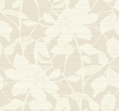 The Solange Botanical Wallpaper by York Wallcoverings features a beige background adorned with a subtle, textured floral and leaf pattern in off-white, showcasing large overlapping leaves and flowers on a smooth surface.