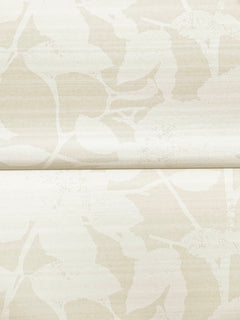 Solange Botanical Wallpaper by York Wallcoverings features a subtle beige background adorned with a faint abstract leaf design, with a visible horizontal seam running across the center of the pattern.