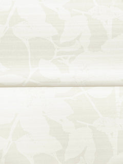 The Solange Botanical Wallpaper by York Wallcoverings features a subtle, light beige background adorned with a soft, abstract leaf pattern. The leaves are delicately outlined with gentle texture, while a visible horizontal seam runs across the center for added character, creating a minimalistic and elegant design.