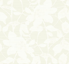 Solange Botanical Wallpaper by York Wallcoverings features a subtle floral pattern with large white flowers and leaves set against a light beige background, offering a soft, delicate, and textured look.