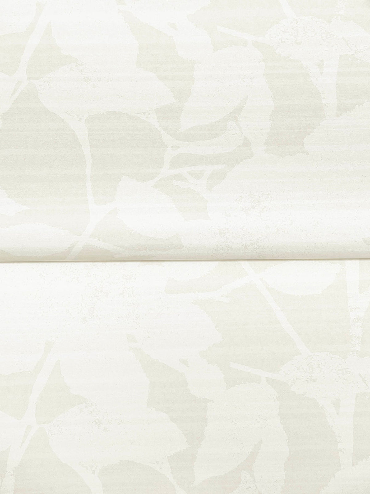 The Solange Botanical Wallpaper by York Wallcoverings features a subtle, textured pattern of overlapping pale leaves and branches in soft white and off-white tones, accented by a faint horizontal seam across the center.