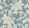 The Solange Botanical Wallpaper by York Wallcoverings features cream-colored floral silhouettes with leaves and stems layered over a textured blue background, offering a nature-inspired patterned design.
