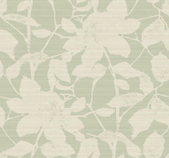 The Solange Botanical Wallpaper by York Wallcoverings features a pale green background adorned with a subtle pattern of large, cream-colored floral silhouettes and leaves, creating a soft, textured botanical look.