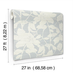 The Solange Botanical Wallpaper by York Wallcoverings features a white floral pattern on a light blue background and comes in a rolled sheet measuring 27 feet (8.22 m) in length and 27 inches (68.58 cm) in width.