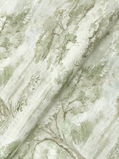 A close-up of the Moreno Woodland Wallpaper by York Wallcoverings, showcasing a watercolor-style green and beige landscape print with trees and foliage that creates a soft, serene, and airy pattern.