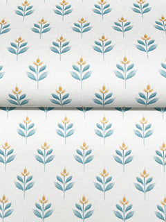 York Wallcoverings’ Serene Villa Floral Stamp Wallpaper features a repeating pattern of stylized blue-green leaves and small yellow flowers, arranged in evenly spaced rows on a light background.