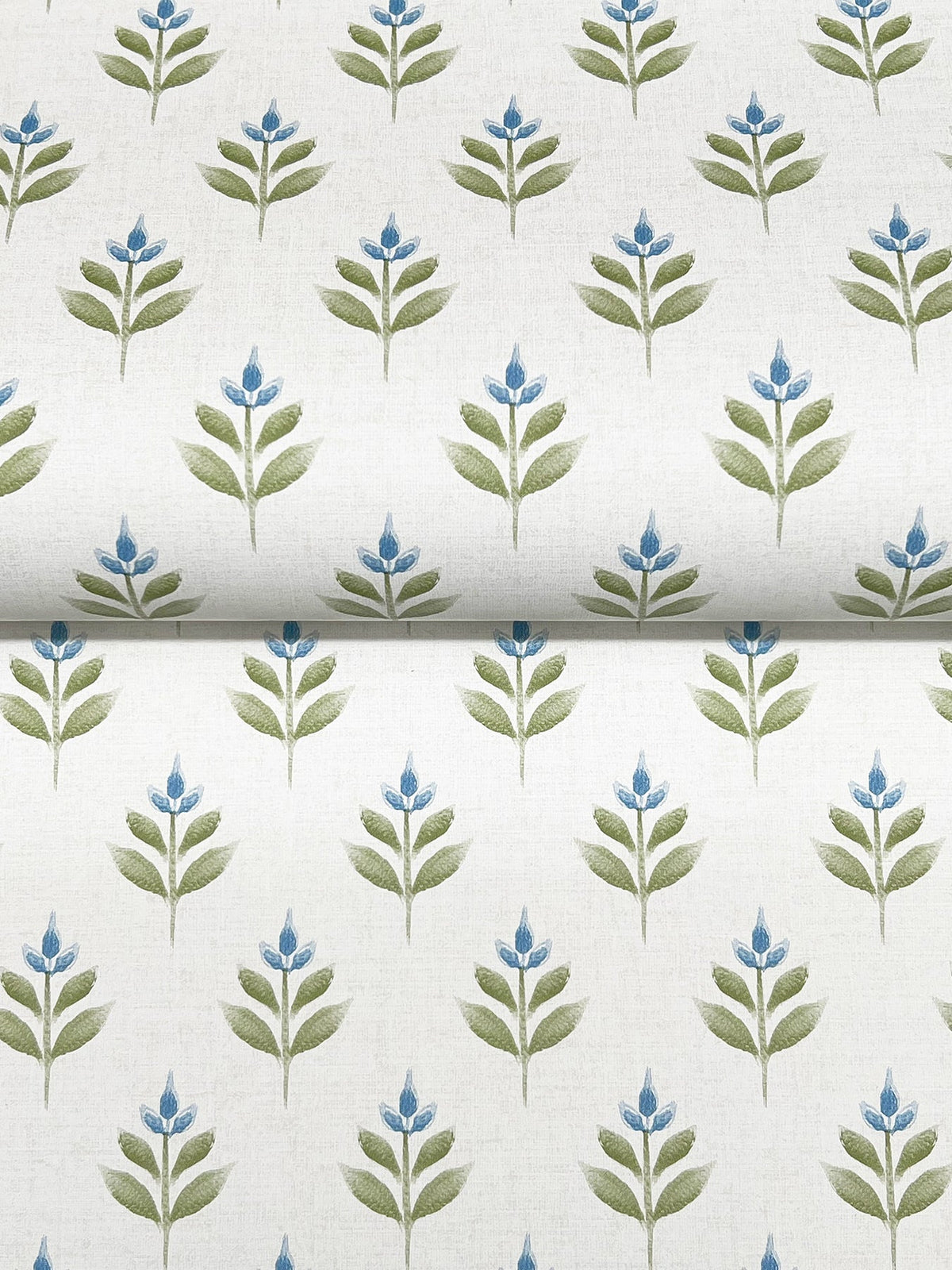 Serene Villa Floral Stamp Wallpaper by York Wallcoverings features a neat, symmetrical pattern of green leafy stems topped with blue flowers on a crisp white background, creating a fresh, botanical look.