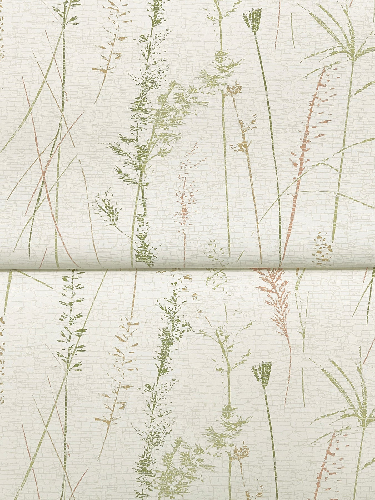 Meadow Splendor Botanical Wallpaper features a light background adorned with delicate, vertical illustrations of various grasses and plants in soft green and muted brown tones, creating a subtle, nature-inspired pattern. A horizontal seam is visible across the image.