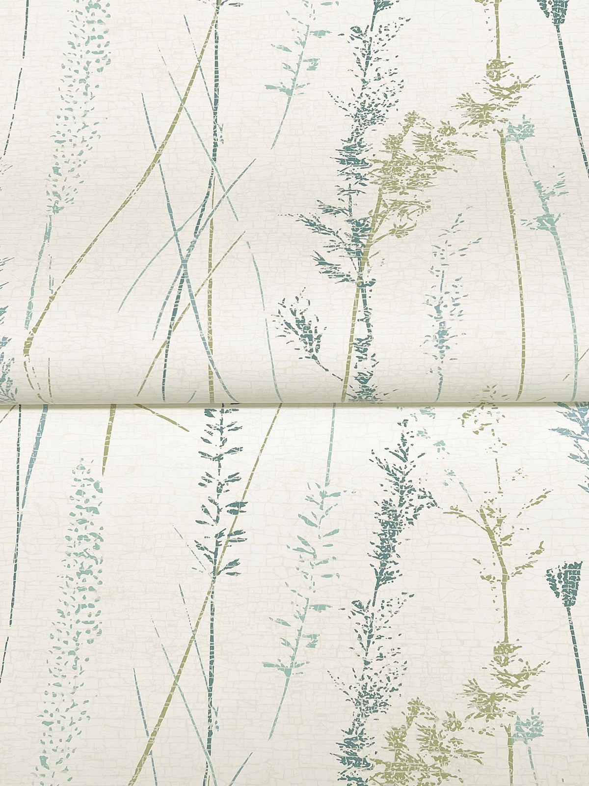 Meadow Splendor Botanical Wallpaper features delicate, vertical silhouettes of grasses and wildflowers in muted green and blue tones on a light background.