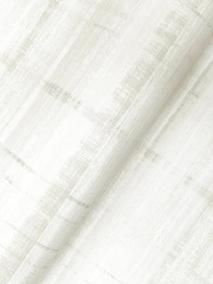 A close-up of Vanishing Point Striated Wallpaper by York Wallcoverings showcases its white surface adorned with a subtle, textured linear pattern in light gray, creating a soft, brushed effect. The wallpaper is gently folded, adding depth and shadow to the image.