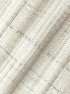 Close-up of York Wallcoverings’ Vanishing Point Striated Wallpaper, featuring a neutral striped pattern in shades of beige, cream, and light gray. The softly textured wallpaper showcases a modern, abstract design and is pictured slightly folded on the diagonal.