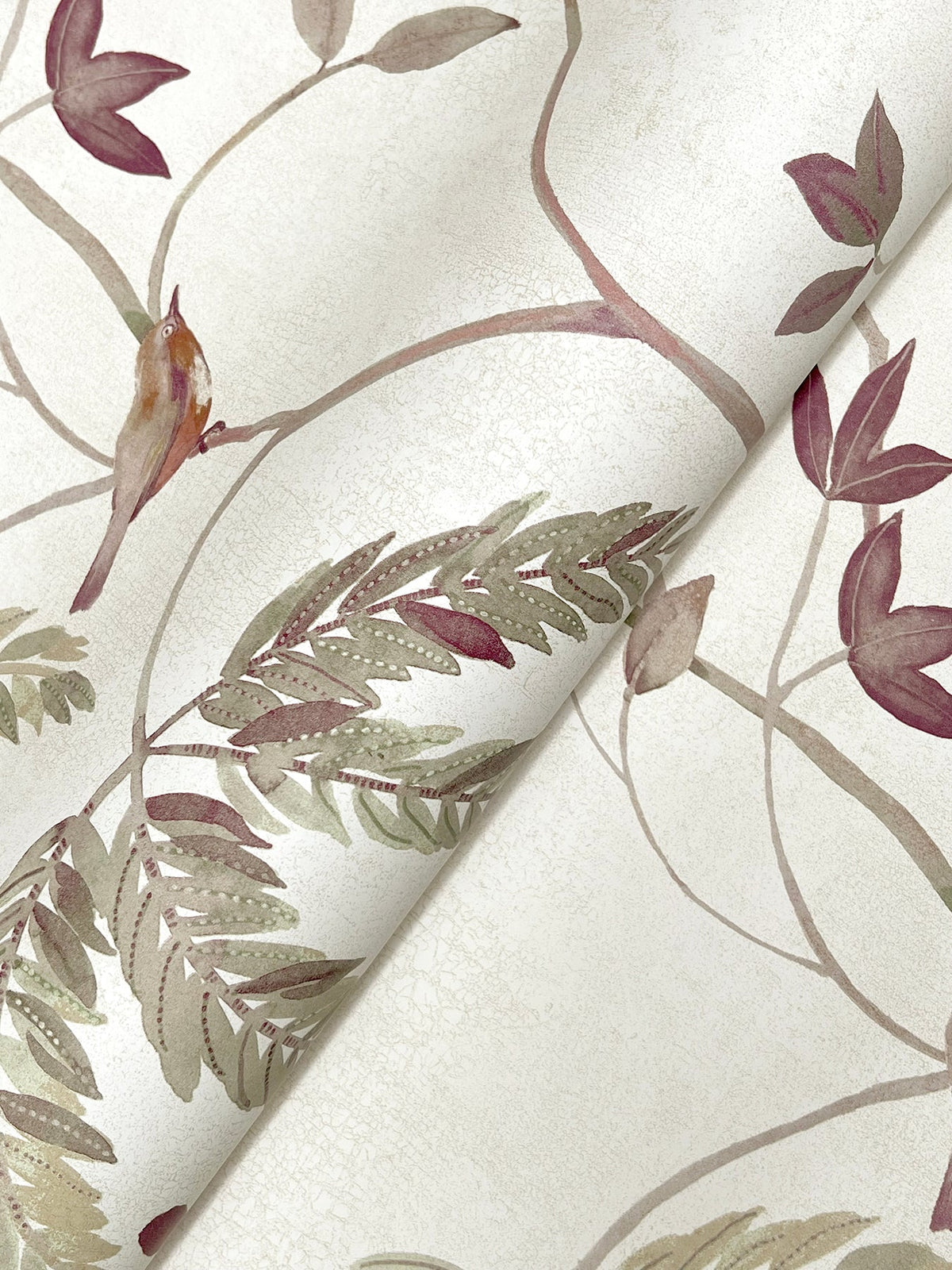 Close-up of the Cillian Botanical Bird Trail Wallpaper by York Wallcoverings, featuring a botanical design with muted green leaves and maroon flowers on a light, textured background. The wallpaper is shown slightly curled.