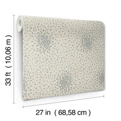 A roll of “Petite Leaves Wallpaper” by York Wallcoverings features a gray leafy pattern on a cream background. The wallpaper measures 33 feet (10.06 m) in length and 27 inches (68.58 cm) in width, as shown with measurement lines.