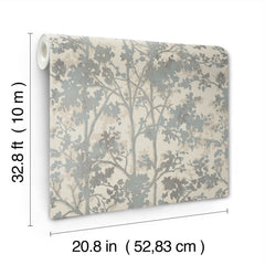 Shimmering Foliage Wallpaper by York Wallcoverings features a gray tree branch pattern and comes in a roll measuring 32.8 ft (10 m) long and 20.8 in (52.83 cm) wide.