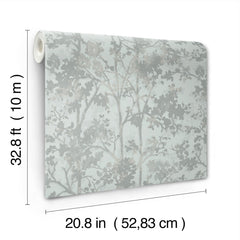 The image displays a roll of York Wallcoverings’ Shimmering Foliage Wallpaper, featuring a light floral pattern. The dimensions—32.8 feet (10 meters) in length and 20.8 inches (52.83 cm) in width—are marked beside the roll.