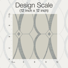 A 12x12 inch square sample of York Wallcoverings’ Graceful Geo Wallpaper displays a geometric pattern with curved gray lines and diamond shapes. Vertical and horizontal rulers along the edges mark each inch, and the text reads “Design Scale (12 inch x 12 inch)”.