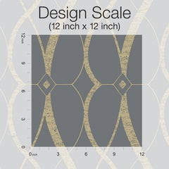 The “Graceful Geo Wallpaper” by York Wallcoverings is displayed in a gray and gold geometric pattern, with a 12 inch by 12 inch square marked to show the design scale and a ruler positioned along the left and bottom edges for reference.