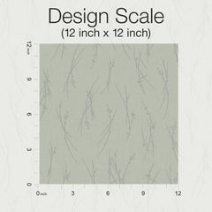 A 12 inch by 12 inch sample of York Wallcoverings’ Sprigs Wallpaper, featuring a subtle branch pattern in gray on a light background, is displayed with inch markers along the left and bottom edges.