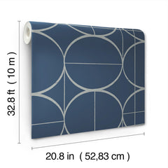 The Sun Circles Wallpaper by York Wallcoverings features a blue background with silver geometric circles and lines, and comes in a roll measuring 32.8 feet (10 meters) long by 20.8 inches (52.83 cm) wide.