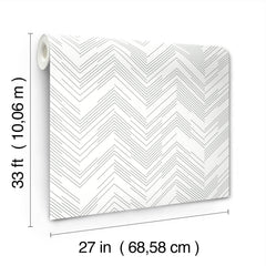The Polished Chevron Wallpaper by York Wallcoverings features a white background with a subtle gray chevron pattern and comes in a roll measuring 33 feet (10.06 m) long by 27 inches (68.58 cm) wide.
