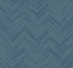 Polished Chevron Wallpaper by York Wallcoverings features a modern, geometric design with thin white chevron-shaped lines set against a blue background in a repeating zigzag pattern, creating a stylish and textured look.