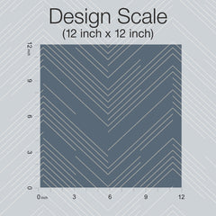 The Polished Chevron Wallpaper by York Wallcoverings features a 12x12 inch square sample with a dark background and light diagonal lines forming chevron patterns, overlaid with a scale and labeled “Design Scale (12 inch x 12 inch).”.