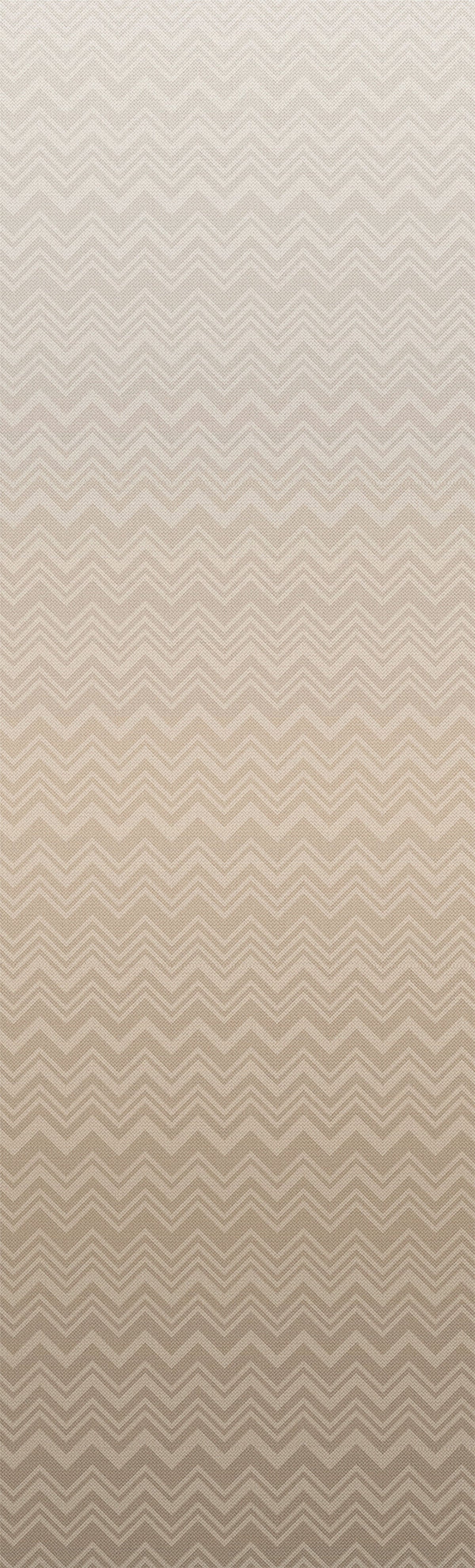 Iconic Shades Wallpaper by York Wallcoverings features a beige background adorned with a subtle zigzag pattern that gently transitions from a lighter shade at the top to a deeper beige hue at the bottom.