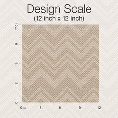 Square swatch of Iconic Shades Wallpaper by York Wallcoverings in a light brown herringbone pattern, displayed with a ruler scale along the top and left side, labeled Design Scale (12 inch x 12 inch) on a textured light background.