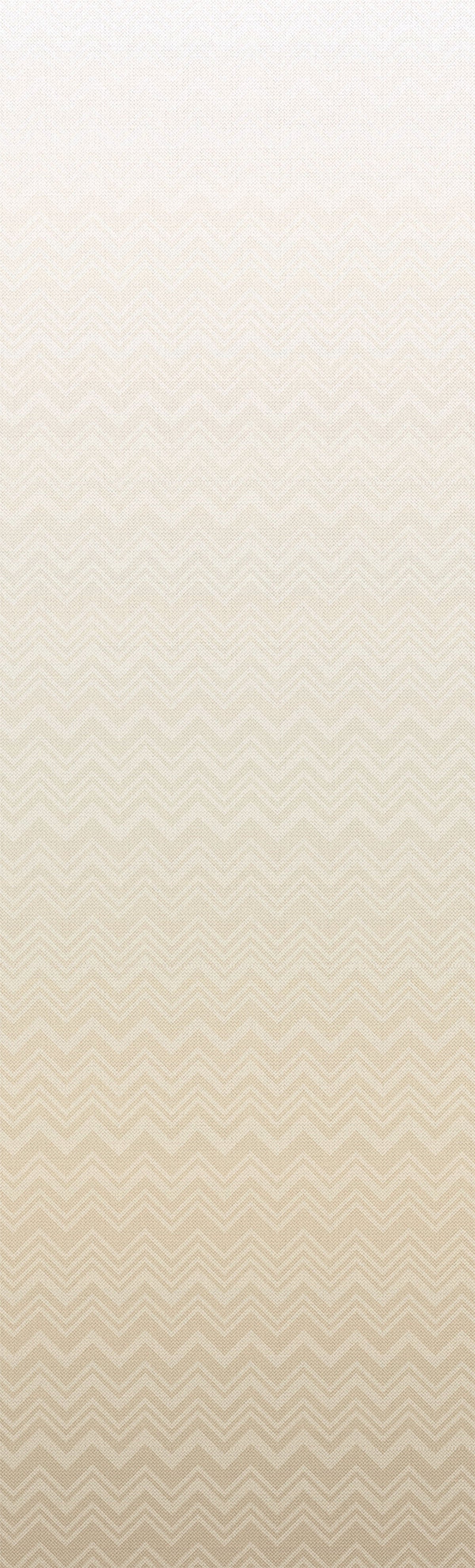 The Iconic Shades Wallpaper by York Wallcoverings features a beige background with a subtle, repeating zigzag pattern that gradually fades from more defined at the bottom to lighter and less distinct at the top.