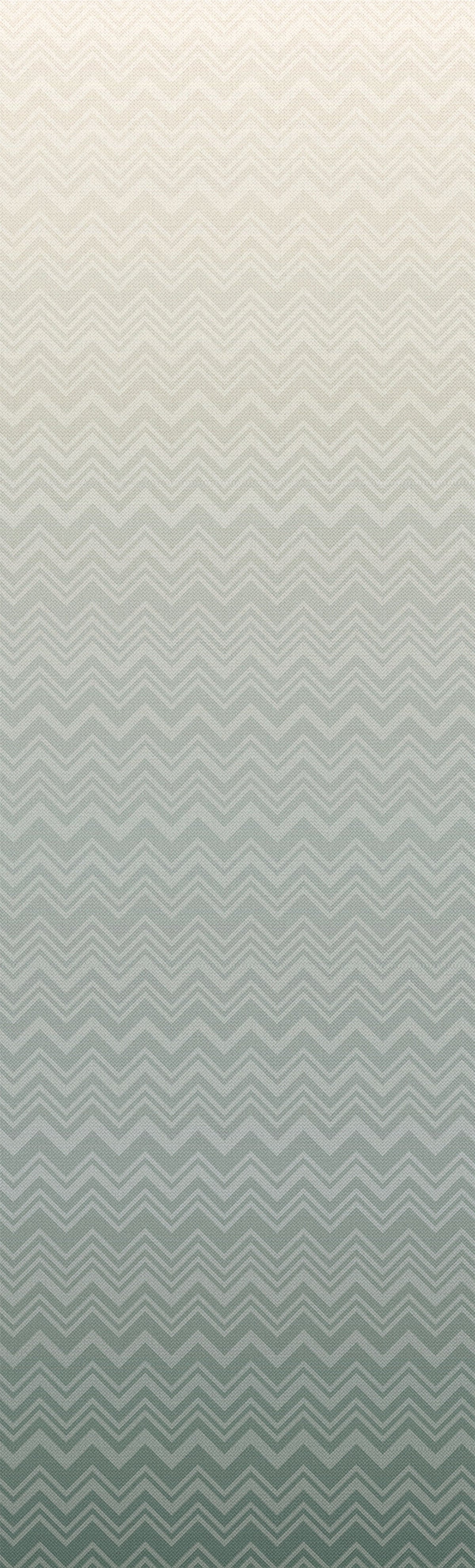 The Iconic Shades Wallpaper by York Wallcoverings features a gradient background with a subtle chevron zigzag pattern, fading from light beige at the top to soft green at the bottom.