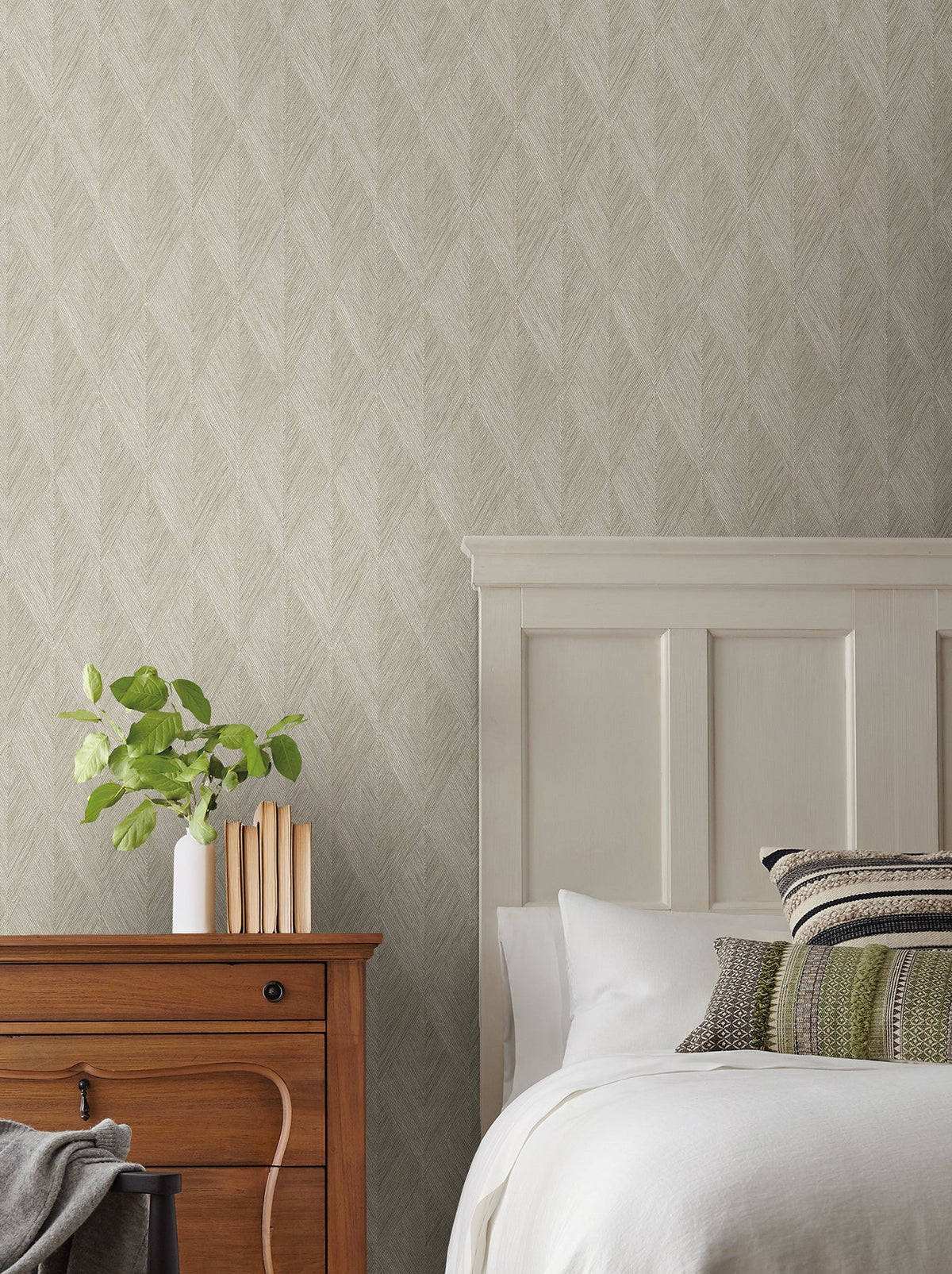 Bedroom wall featuring Magnolia Home Challenger Wallpaper by York Wallcoverings with a textured, neutral-toned herringbone pattern.