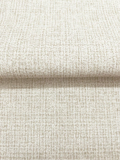 Magnolia Home Brindled Wallpaper featuring a neutral, textured pattern with a grid-like arrangement of small, light brown flecks on an off-white background.