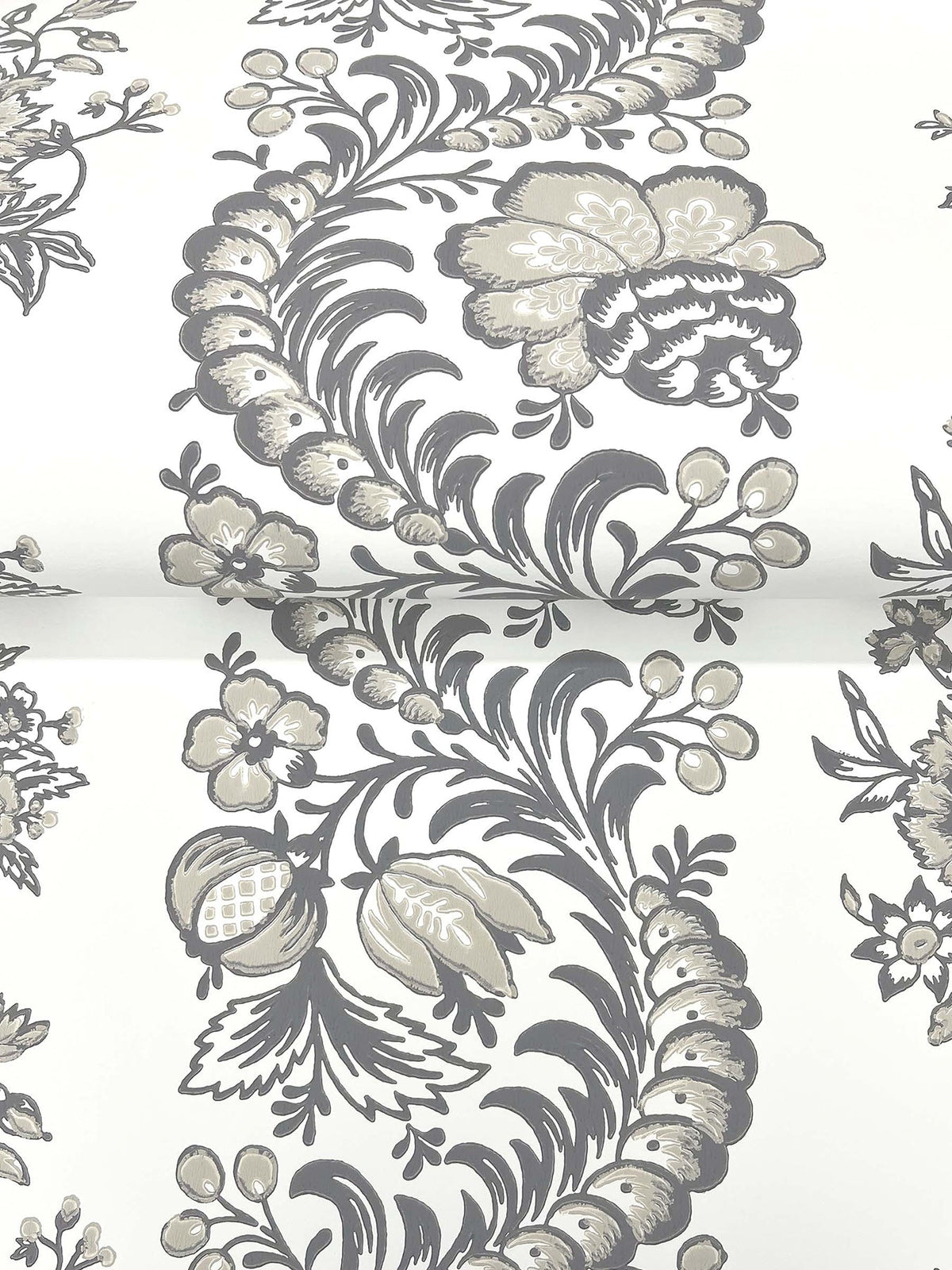The Beaumont Floral Stripe Wallpaper by York Wallcoverings showcases an elegant combination of gray and beige floral patterns, featuring vintage-inspired flowers, leaves, and berries gracefully arranged on a crisp white background. This timeless design offers a classic and sophisticated look.