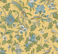 The Parterre Jacobean Wallpaper by York Wallcoverings showcases an intricate pattern of blue, white, and green flowers with leafy branches and birds with long tail feathers perched among the foliage, all set against a yellow background.