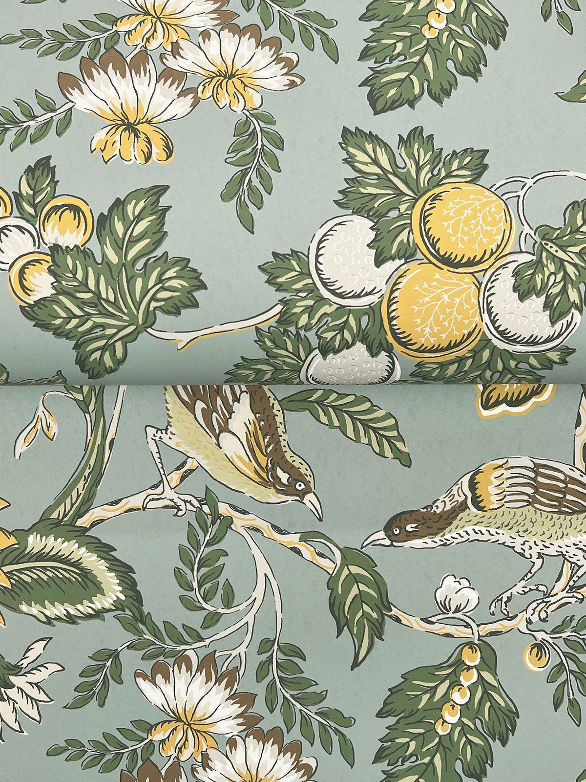 The Parterre Jacobean Wallpaper by York Wallcoverings features a floral design with green leaves, white and yellow flowers, yellow fruits, and two brown and yellow birds perched on leafy branches against a light blue background.