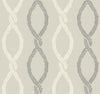 The Laureate Vine Trellis Wallpaper by York Wallcoverings features a seamless pattern of interwoven, leaf-inspired motifs in alternating light beige and gray on a pale background, creating repeating, symmetrical vertical designs.